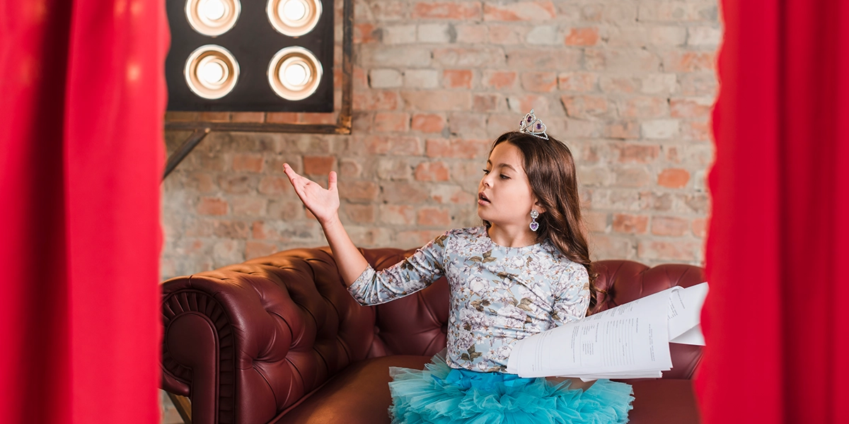 Girl rehearsing her lines on the theater stage