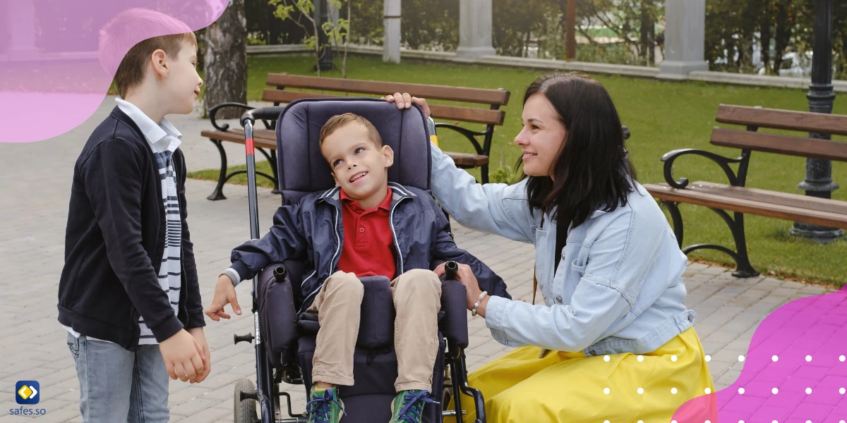 Smiling little boy and mother talking to a disabled child