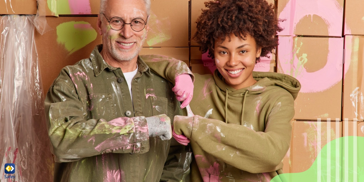 teen covered in paint together with father