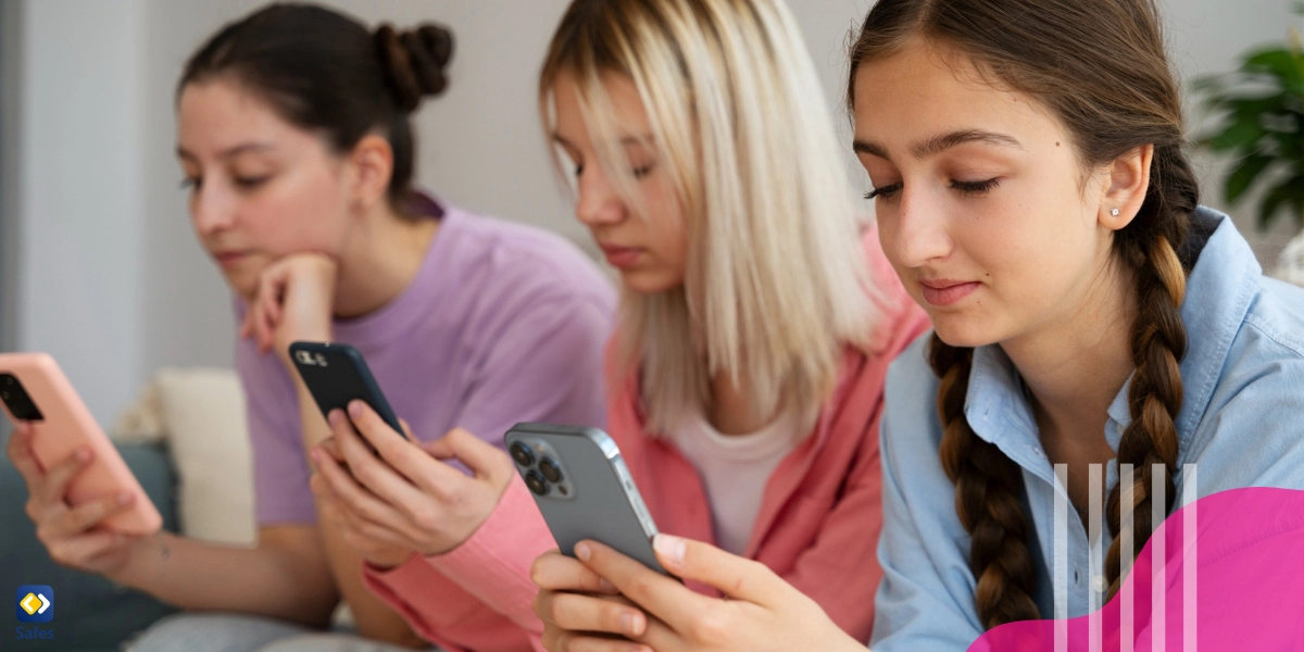 Three teen girls using their phones