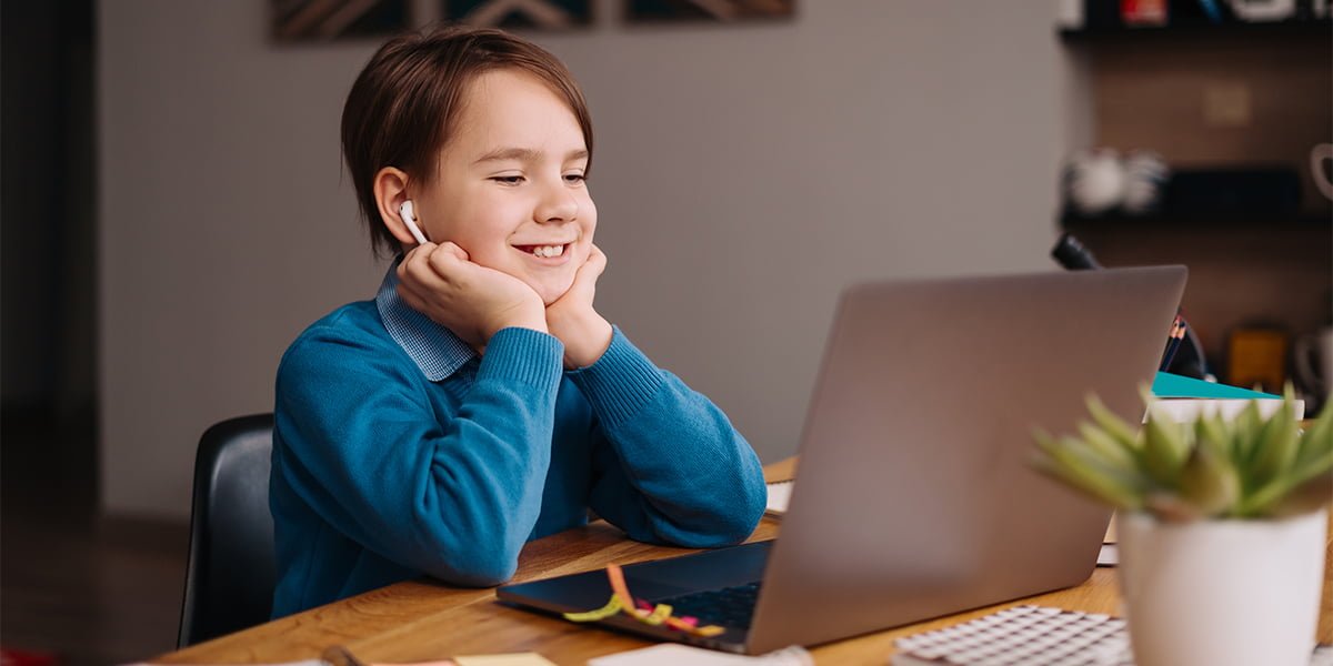 A kid using his laptop