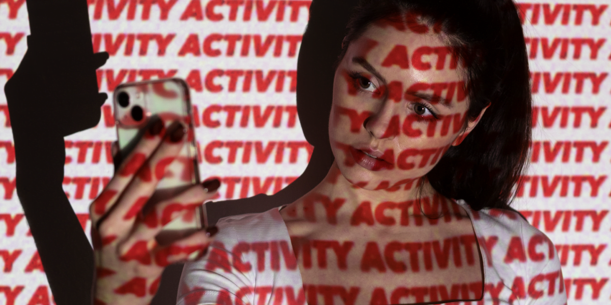 Teen girl taking a selfie while the word "Activity" is written all over the photo