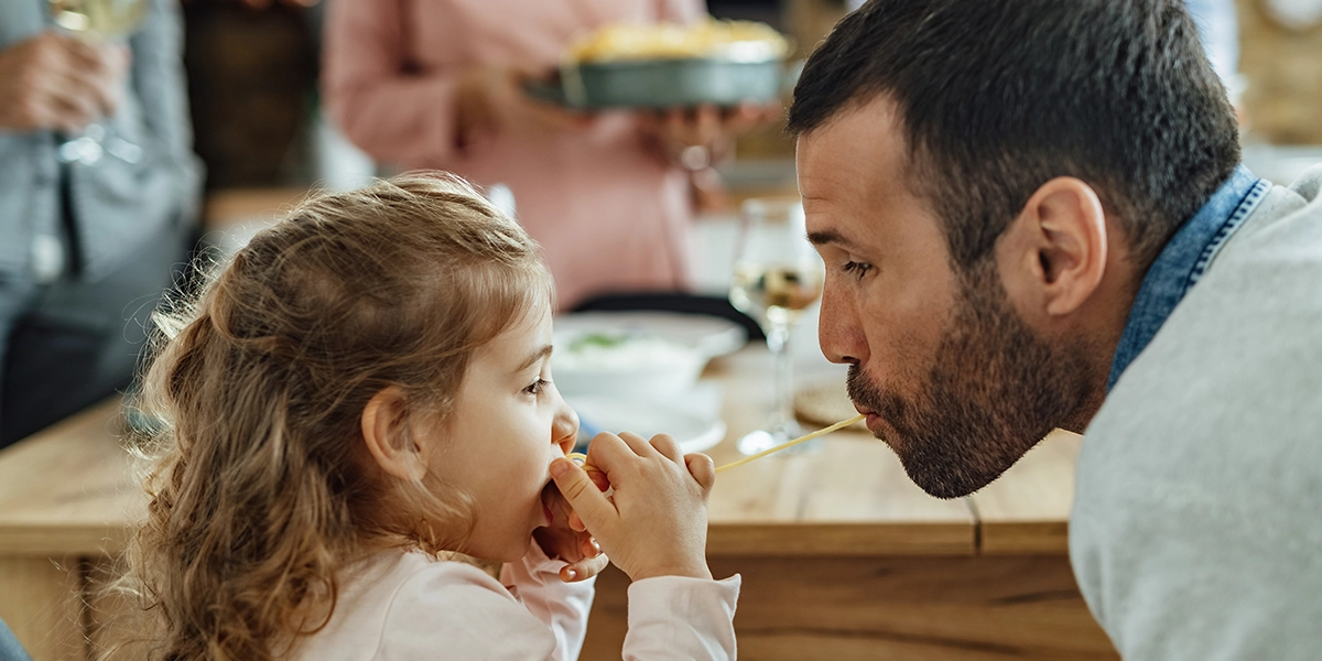 Father and daughter looking at each other