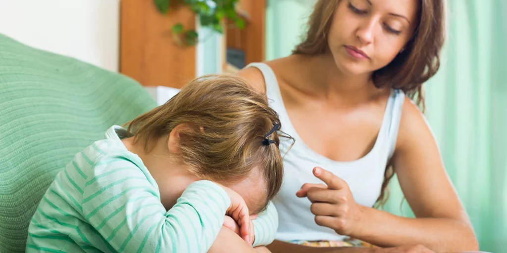 mother preaching to her crying child