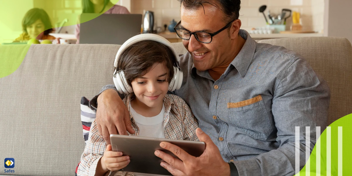 Father teaching his son how to use a tablet responsibly without becoming addicted to it