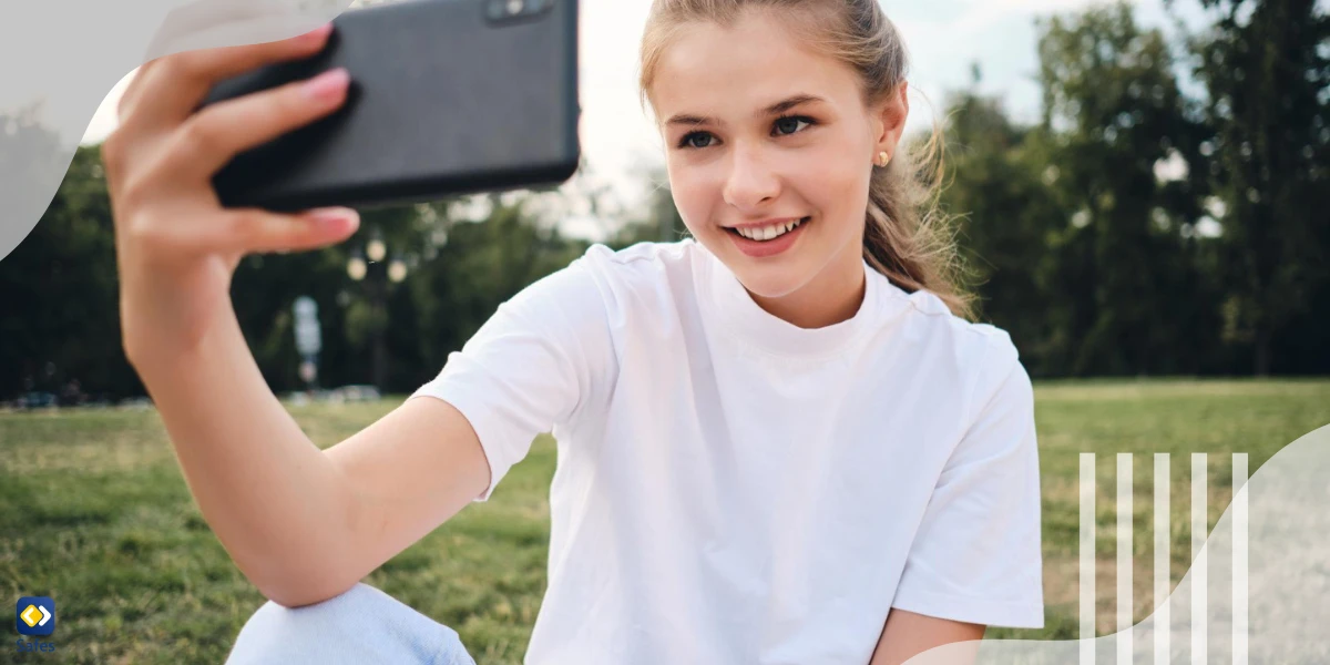 Girl taking a selfie in a park