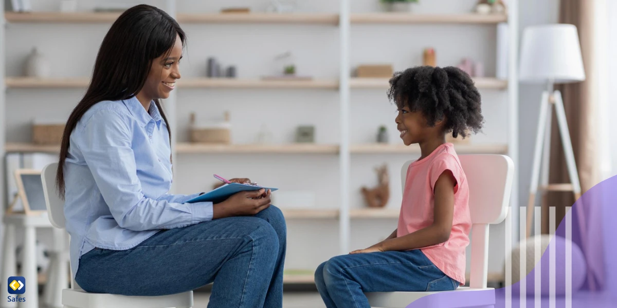 Little girl talking to school counselor