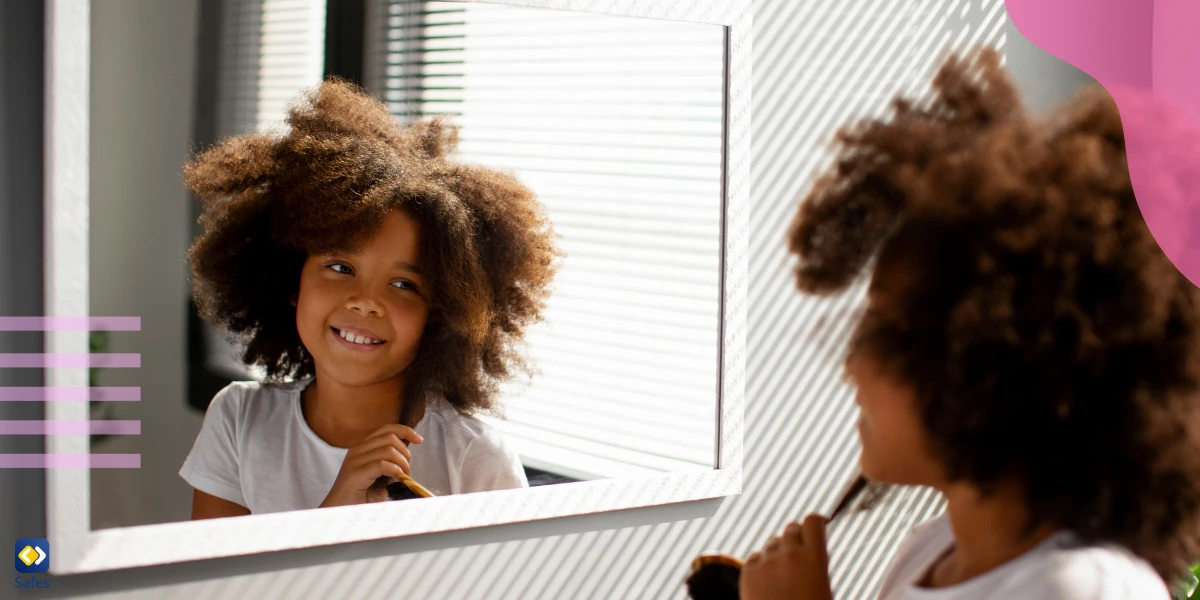 Confident girl looking at herself in the mirror