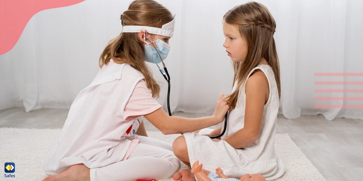 Two young girls playing doctor