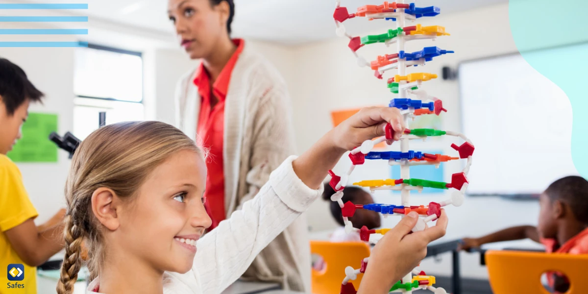 Child posing with her atoms creation