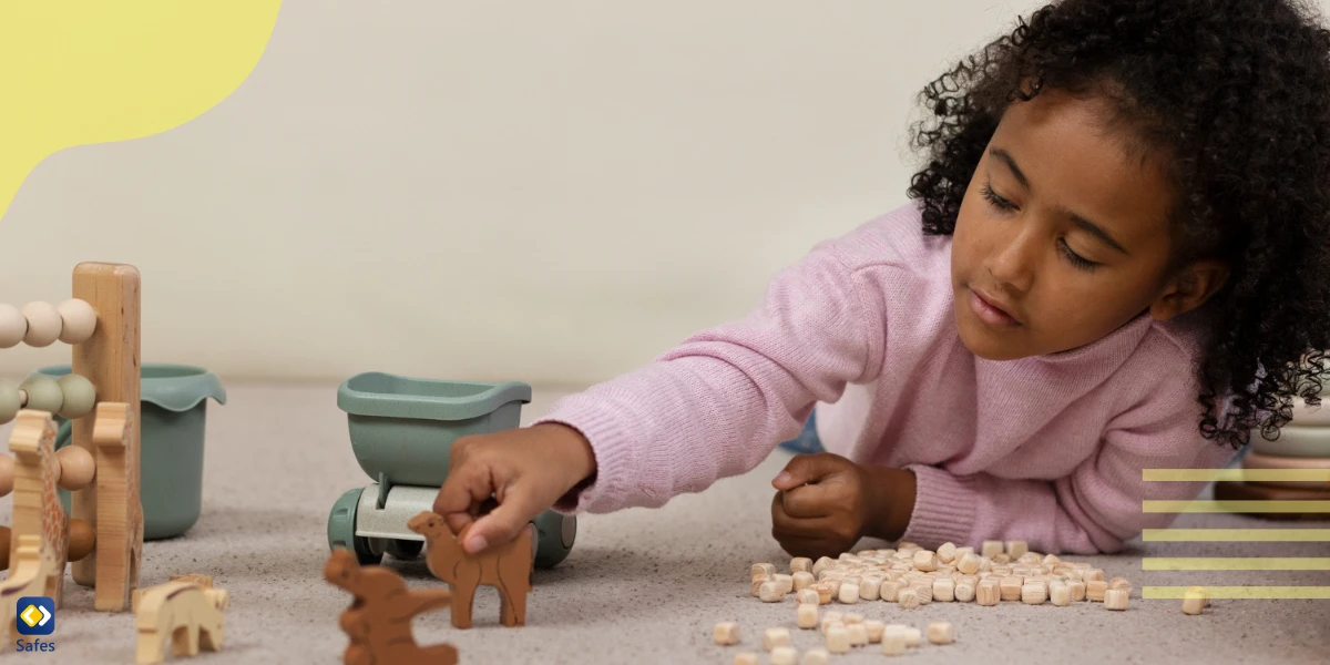 girl playing with wooden toys