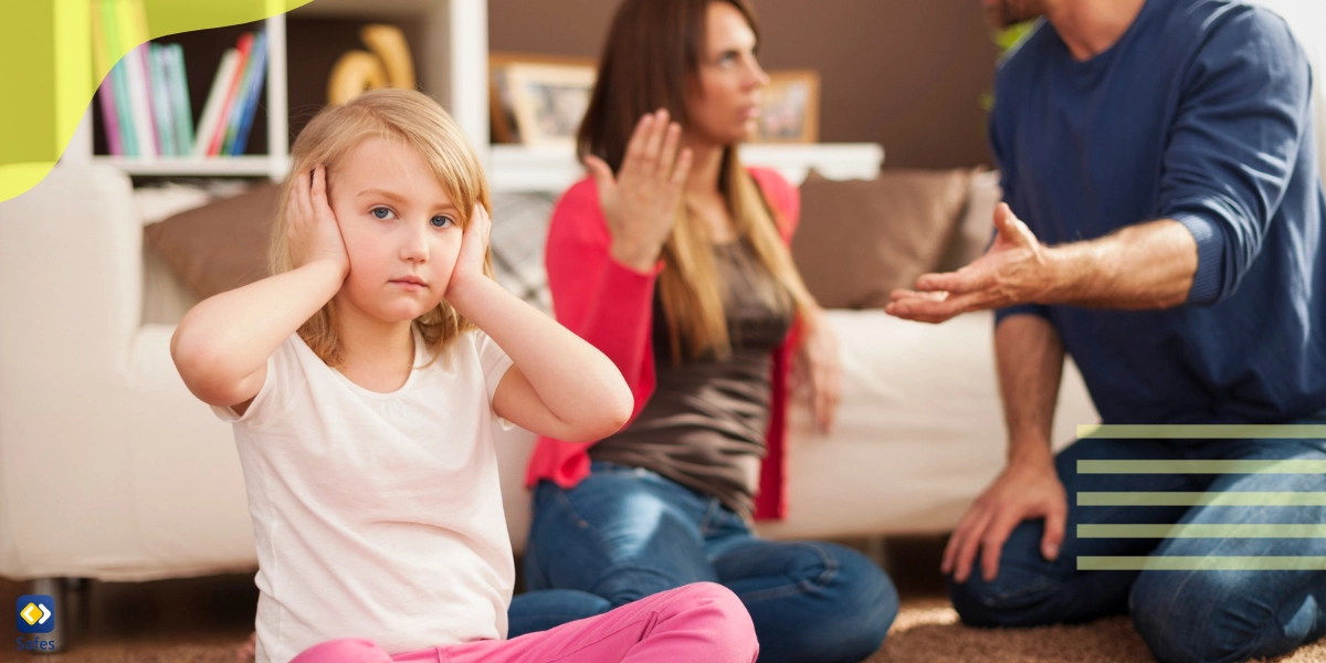 Parents fighting with one another behind a little girl holding her ears