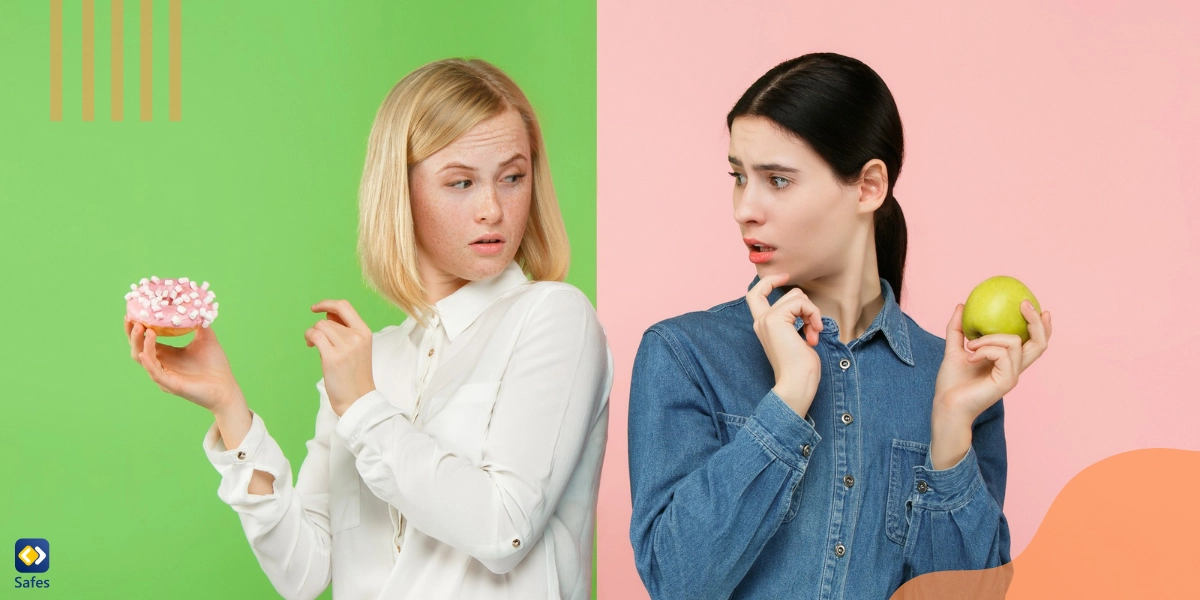 Two girls are holding an apple and a doughnut