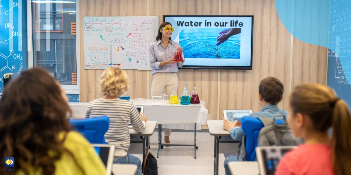 Teacher showing a video in class and doing experiments