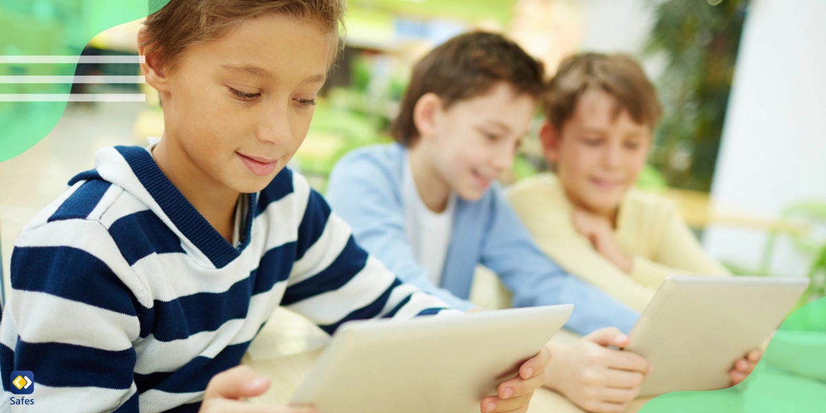 Children communicating digitally using their tablets at school