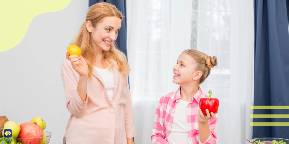 A mom and daughter are cooking with vegetables happily