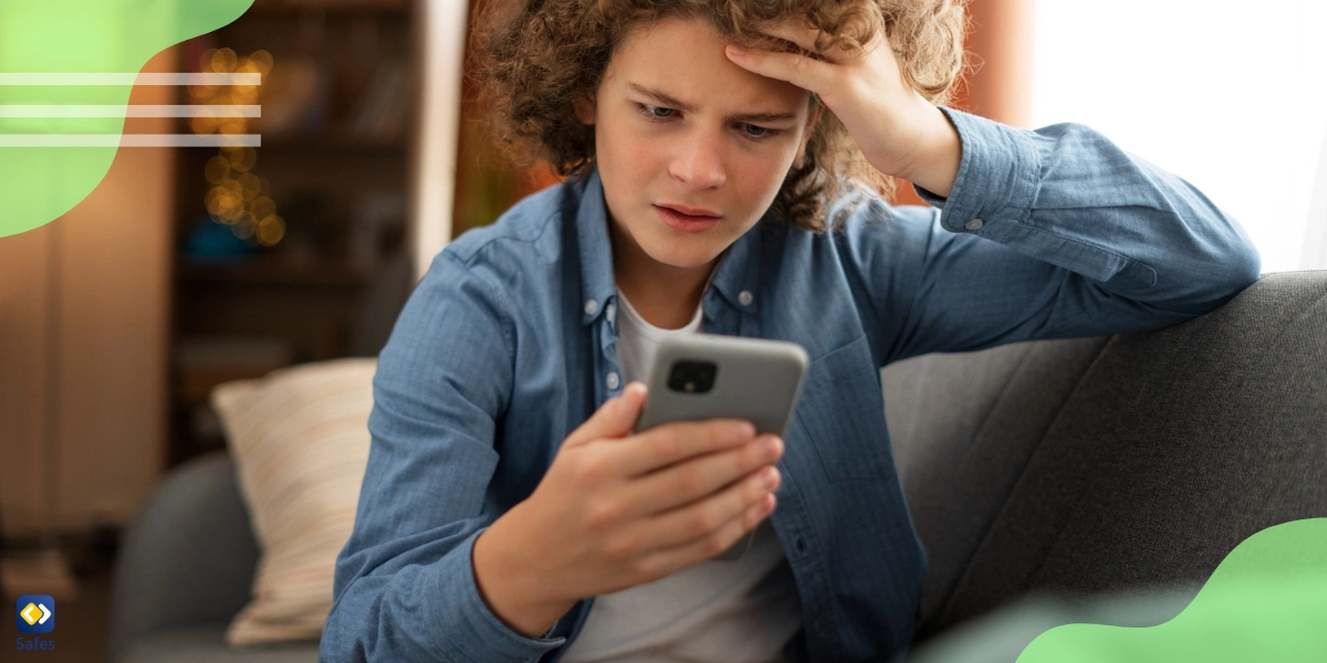 Boy looking at phone anxious because of fear of missing out