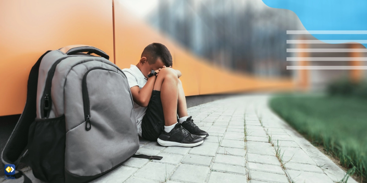 Sad tween skipping school sitting down somewhere outside the school