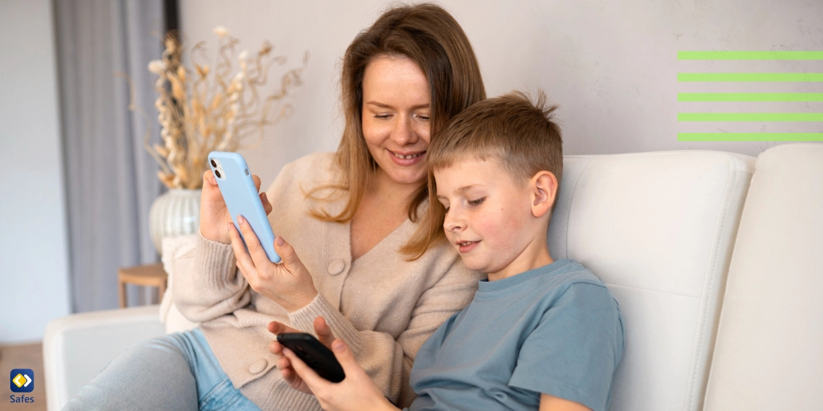 Mother and son looking at their phones on couch