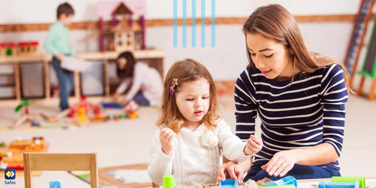 Teacher guiding a child in a kindergarten that has Montessori educational system