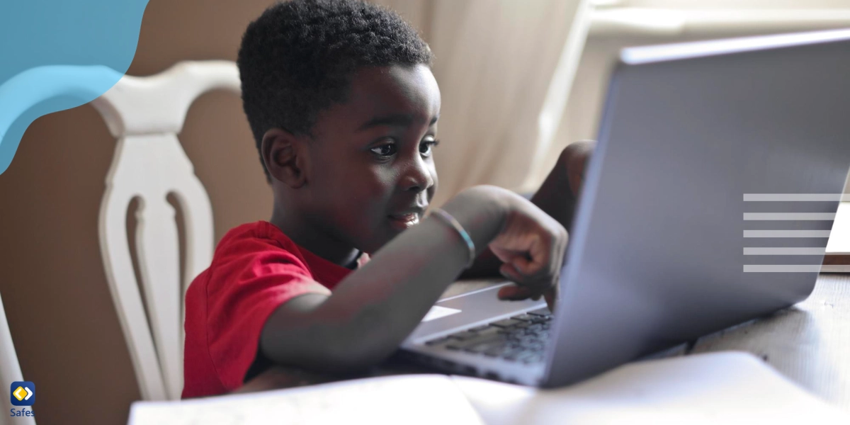 Child using laptop to negate the effects of poverty on education