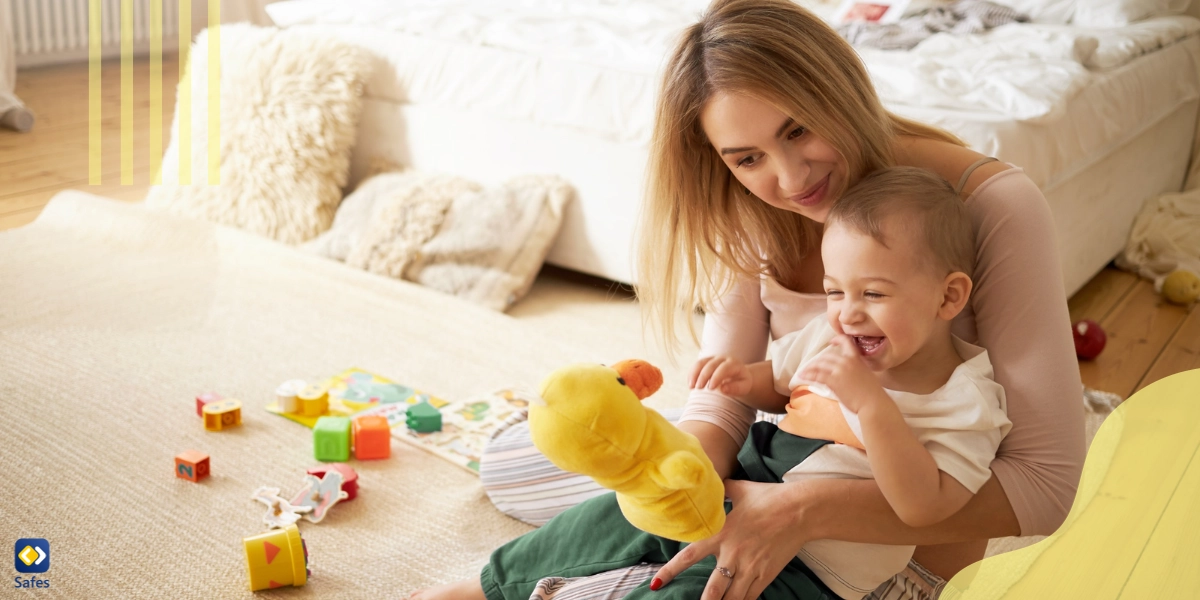 A mother is trying to distract her child from nail-biting by showing him a toy.