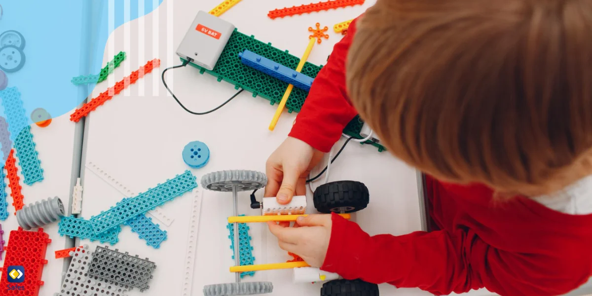 Child making a STEM toy at a kindergarten