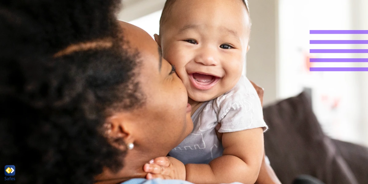 Mother playing with infant smiling