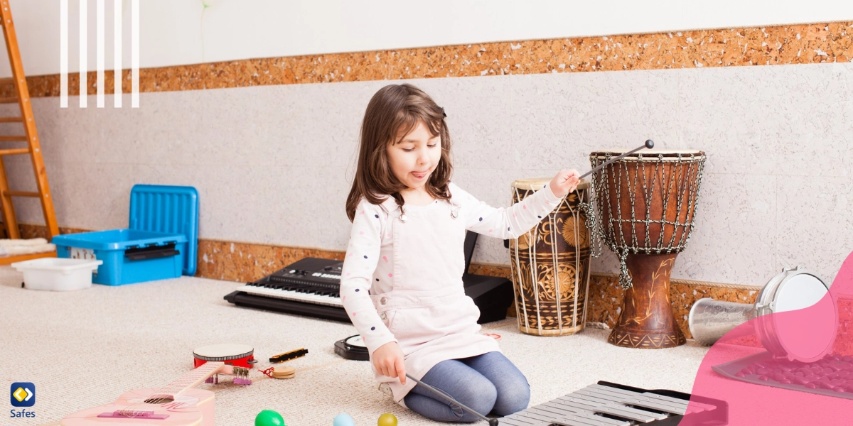 Child practicing playing bells