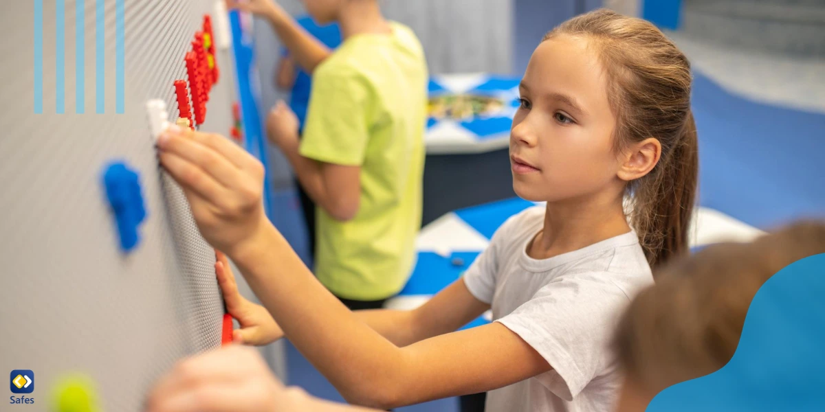 In student-centered classrooms, students are usually involved in activities that require hands-on learning, like this girl who’s attaching Lego pieces to a wall.