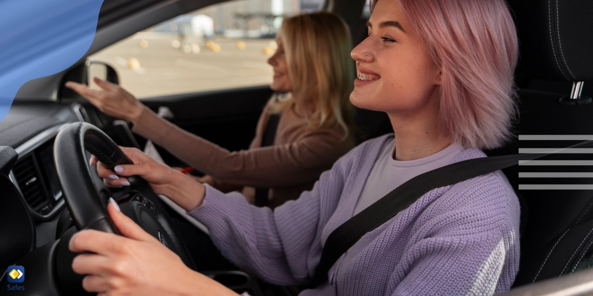 A teenager learning how to drive, guided by her parent.