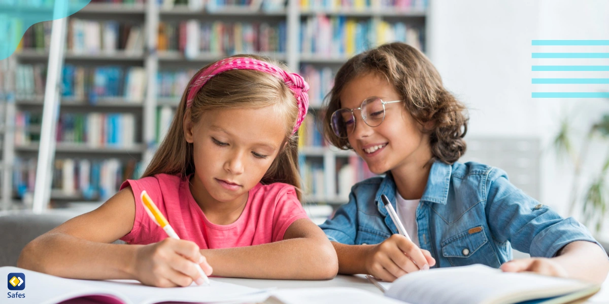 Two children studying together and helping each other with studying more efficiently