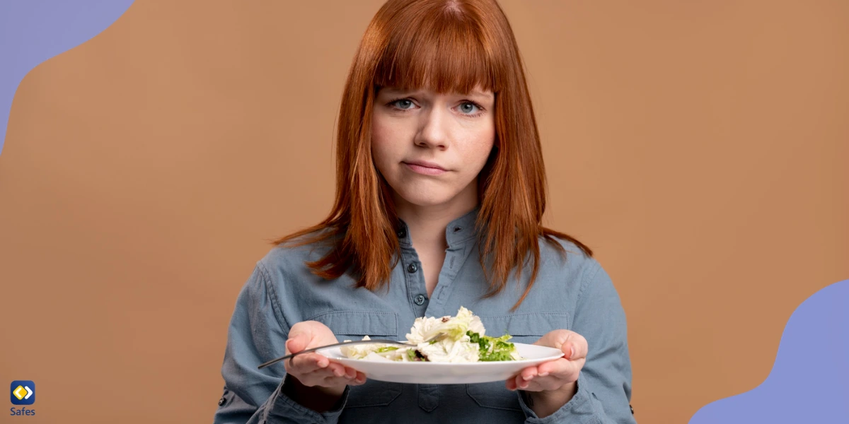 Woman dealing with eating disorder holding plate of salad