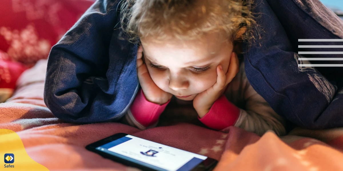 A girl fixated on her phone, waiting for her loot box to open.