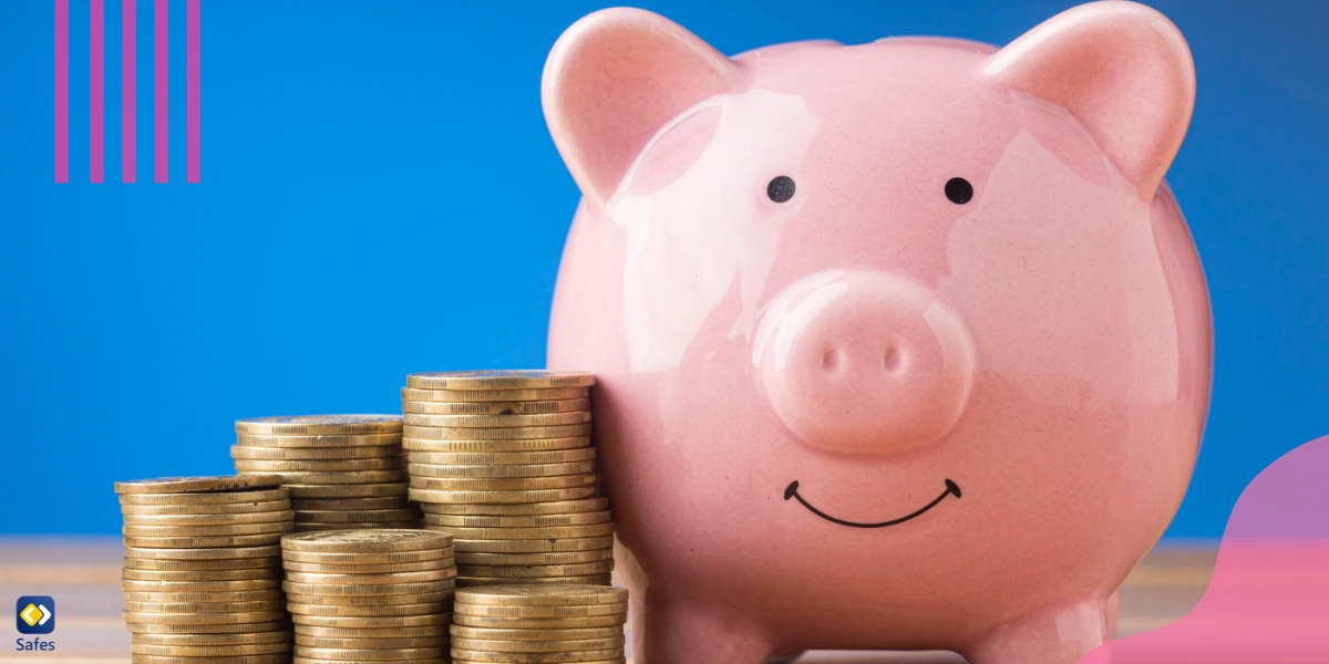 Image of a piggy bank with coins stacked next to it