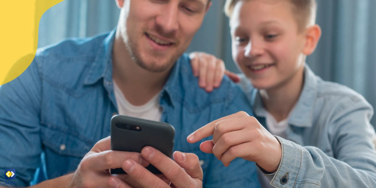 Father monitoring his son’s phone use