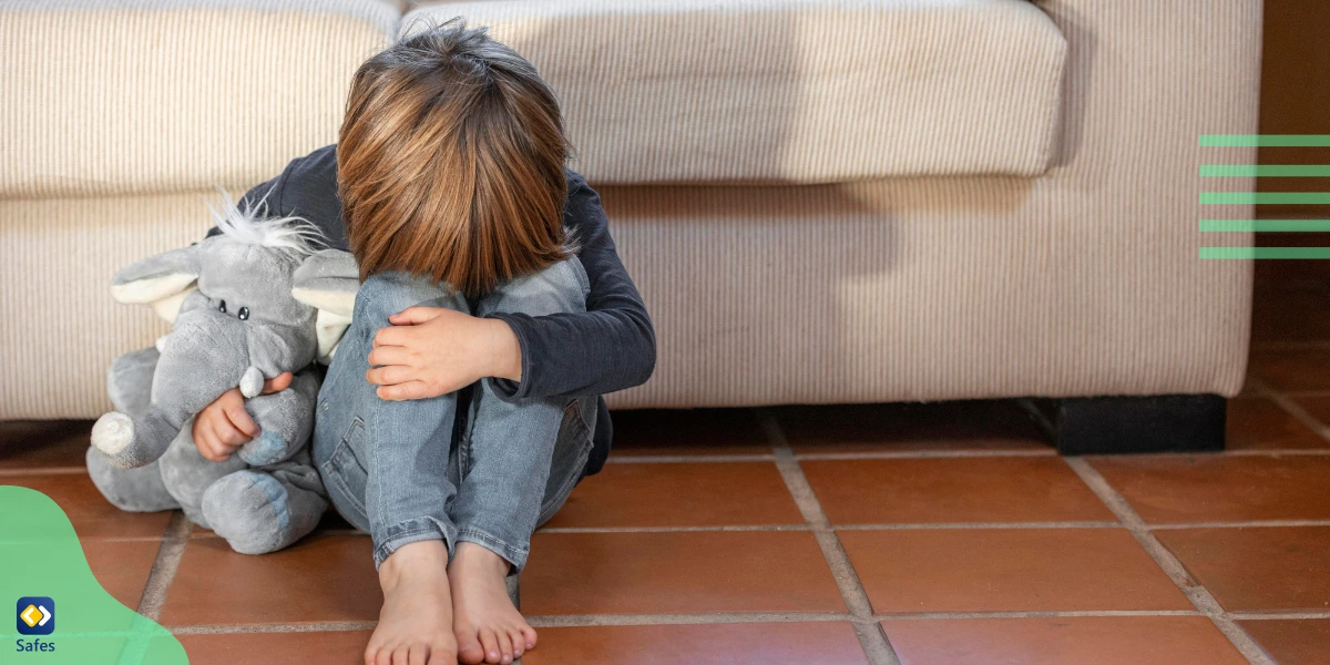 A boy missing his friends from school, showing signs of holiday blues.