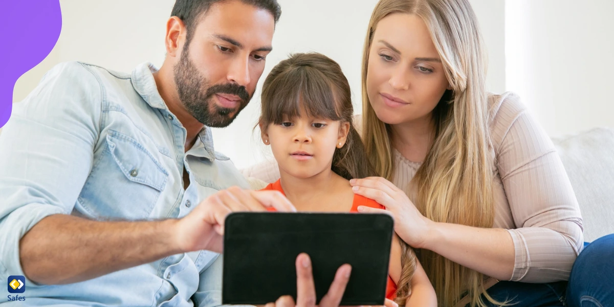 A girl’s parents checking the settings of Zigazoo on her tablet.