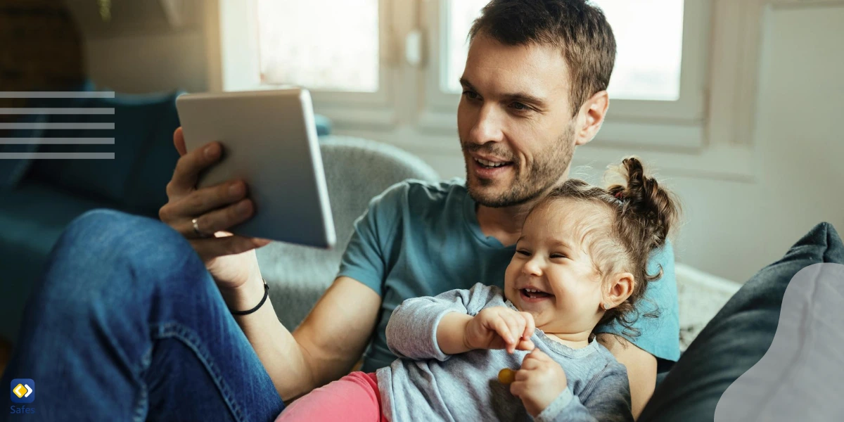 A father and his young daughter using the Lensa app together. This way, the father is less concerned about the adverse effects of using the app.