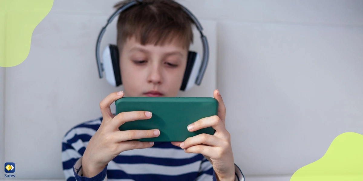 Child playing online games with chat on his phone