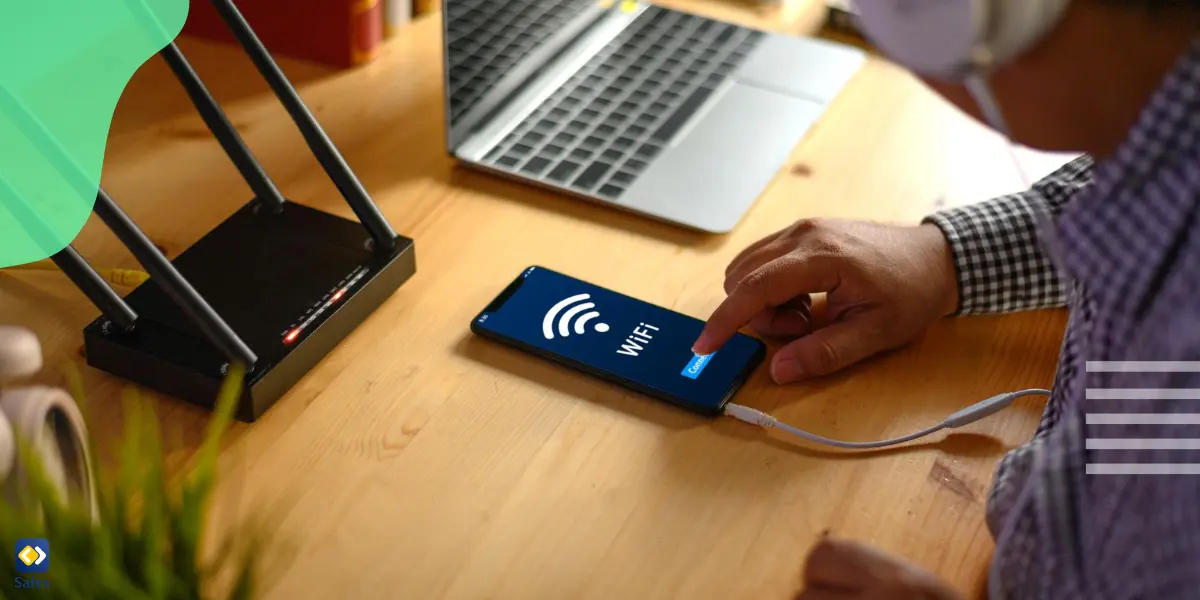 a man using a WiFi router to check his child’s browsing history