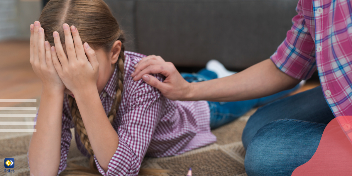 a girl is suffering from hyperactivity and can’t focus on studying while her parent is calming her down.