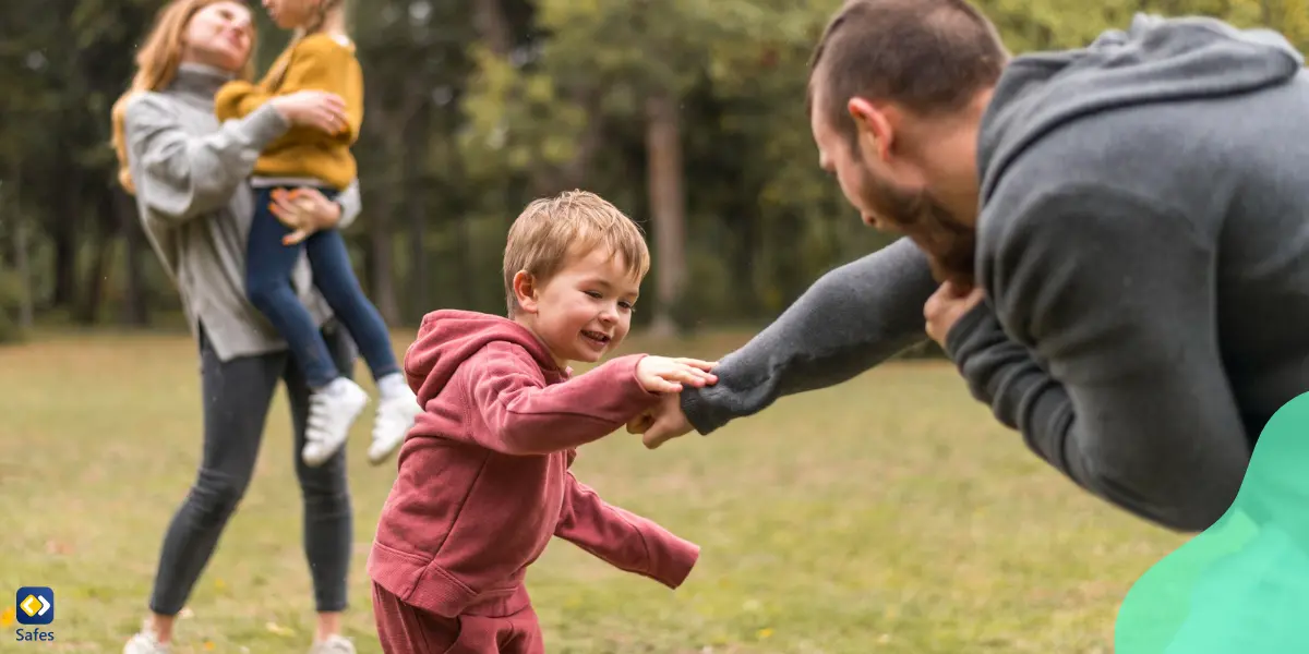 Parents and kids playing together outside and having a good time