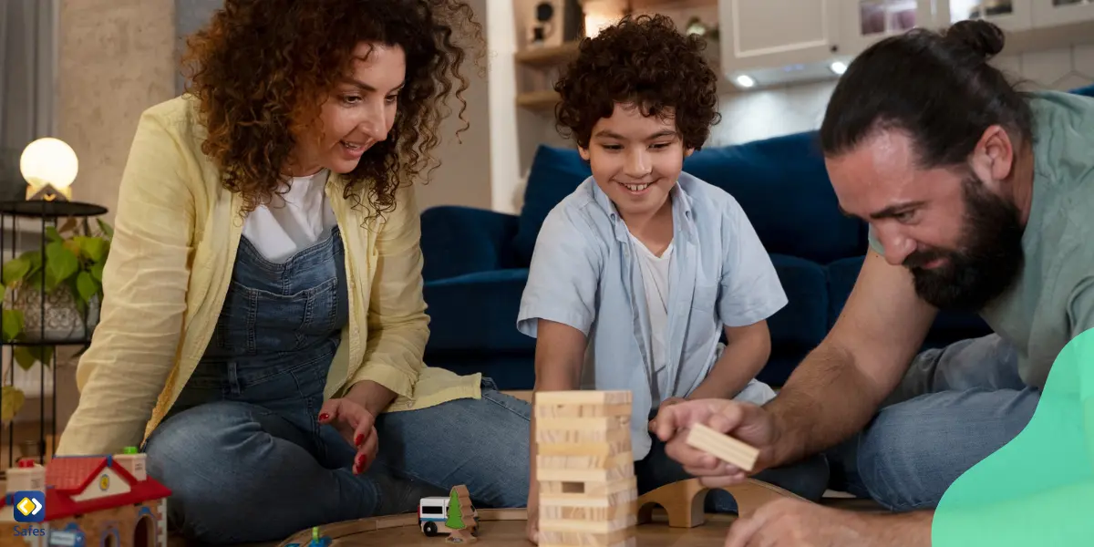 Eine dreiköpfige Familie, die zusammen spielt.