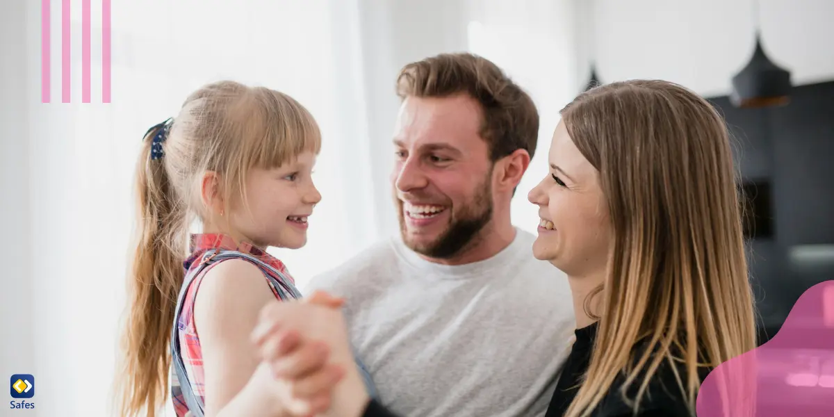 parents holding their young daughter and showing great affection to her