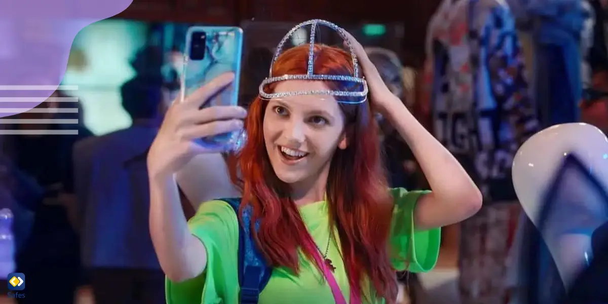 a scene of the Geek Girl series where Harriet is trying on a weird hat and taking a selfie of herself