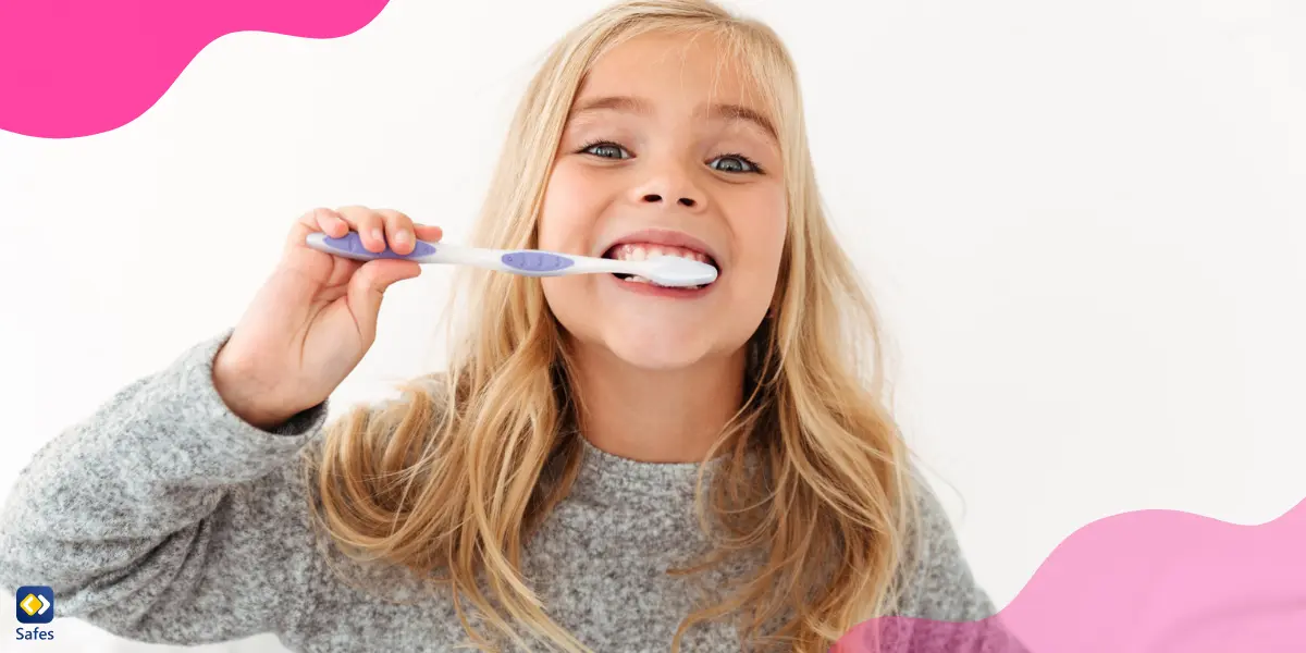 a young girl brushing her teeth