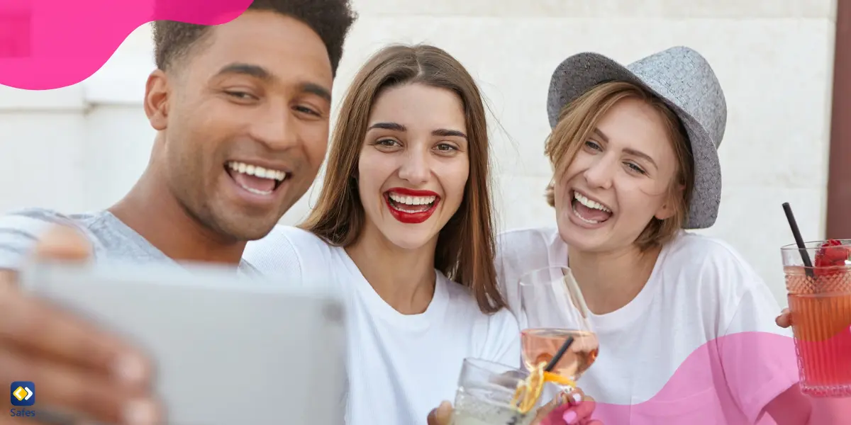 two girls and a boy are taking a selfie to post on social media