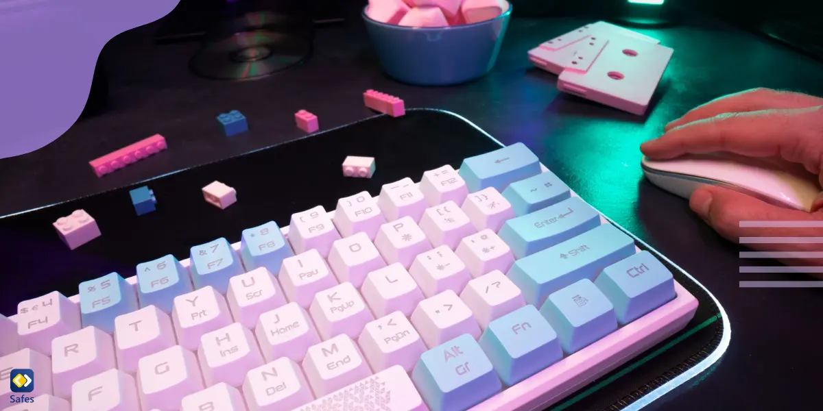 A keyboard and mouse used for online gaming, with blue and pink cast upon them