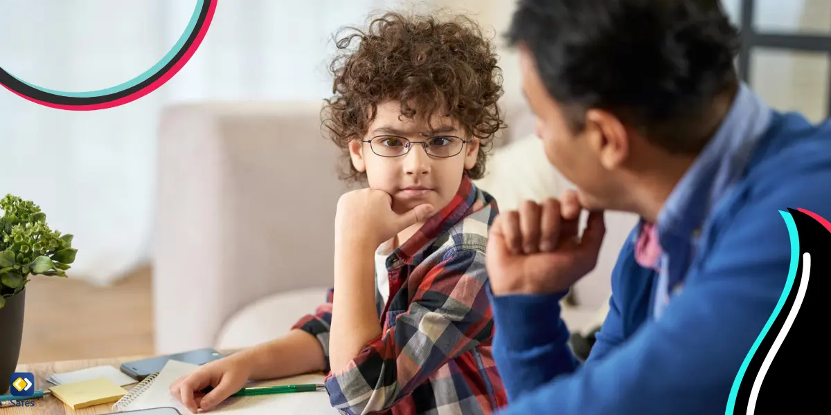 A father discussing the risk and dangers associated with the online world with his son.